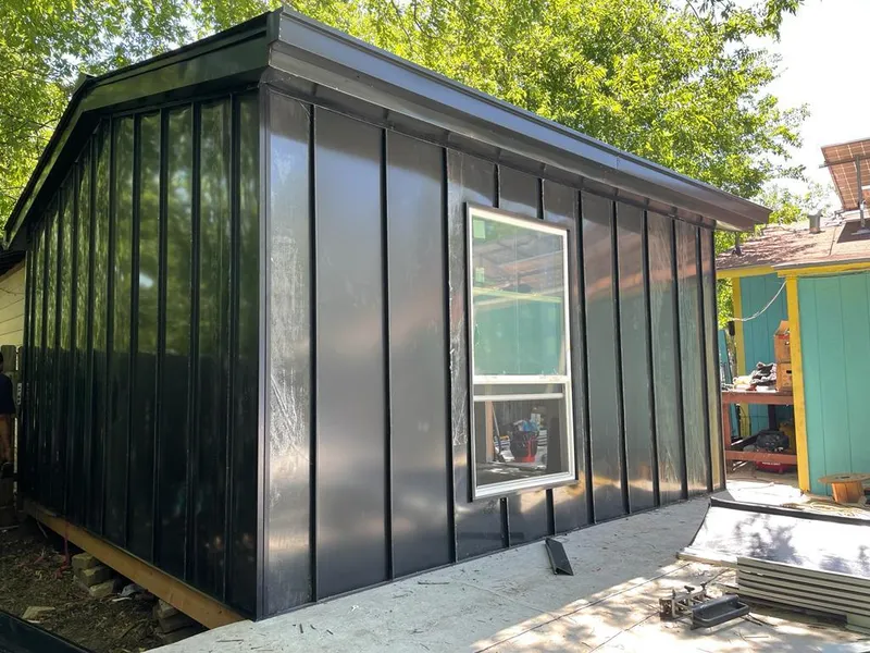 Black standing seam metal wall panels for Roof Inspection in Hooper